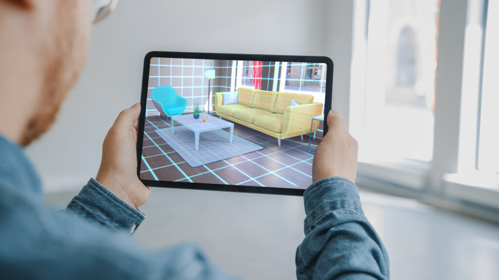 Man Holding Digital Tablet